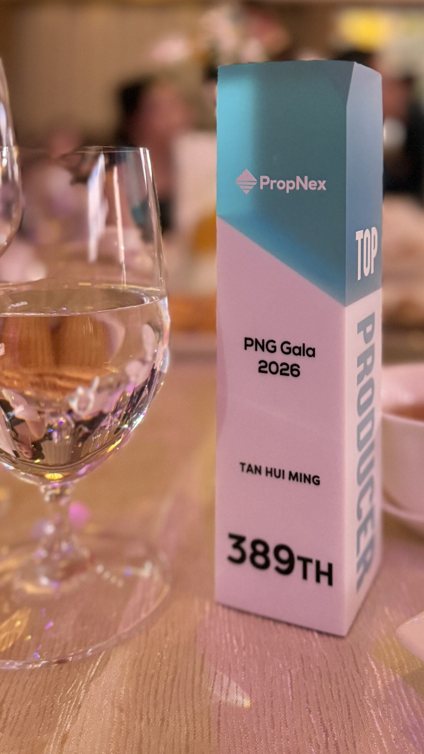 Top Producer award bearing the name Tan Hui Ming and the ranking 389th at PNG Gala 2026.